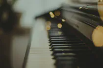 A piano with a very thin depth of field so only a few of the piano keys are in focus